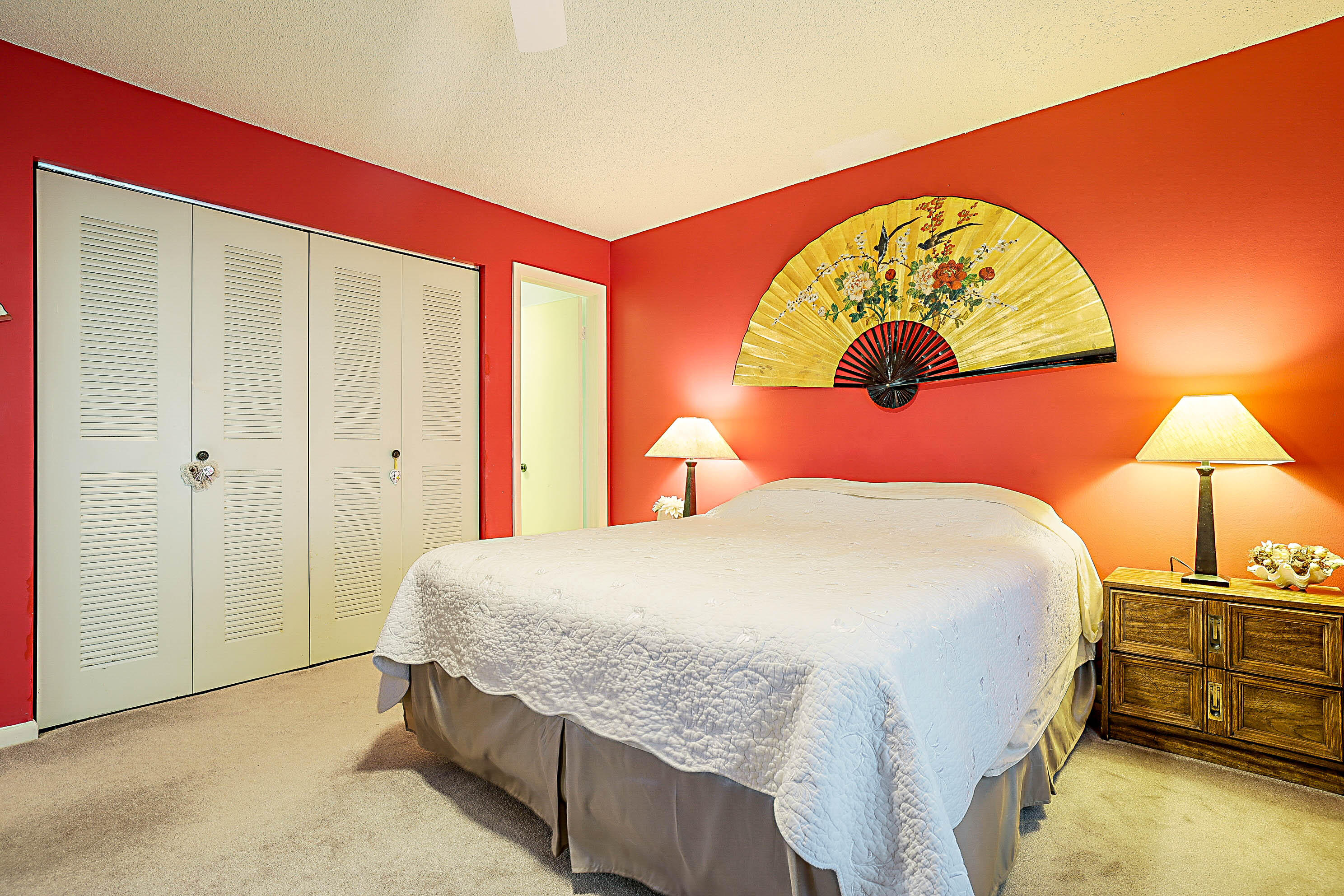 5231 Copperleaf Circle Delray Beach, FL 33484 - Photo 17 of 31 a bedroom with a bed and a painting on the wall