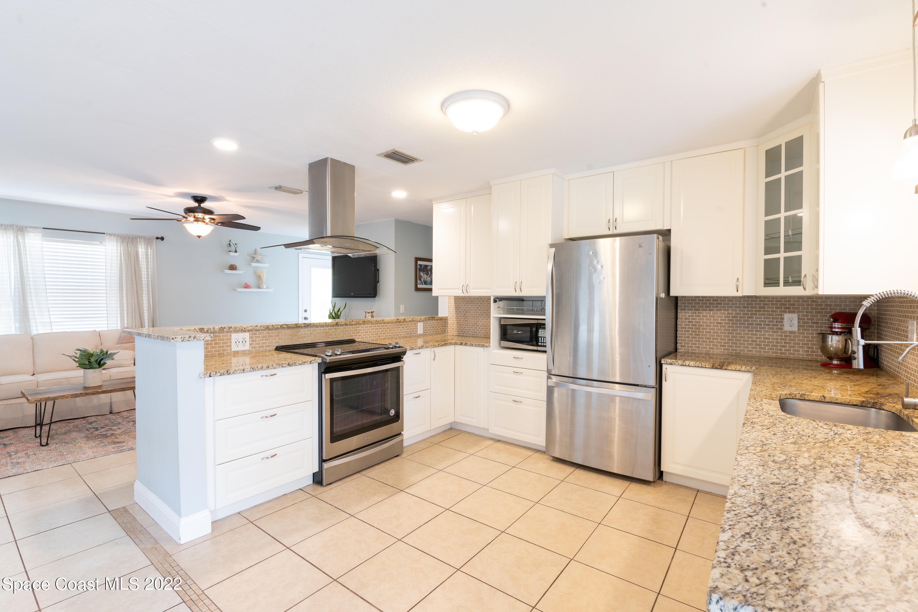 115 Dory Road St. Augustine, FL 32086 - Photo 16 of 31 a kitchen with a refrigerator and a sink