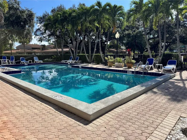 a view of a swimming pool with a patio
