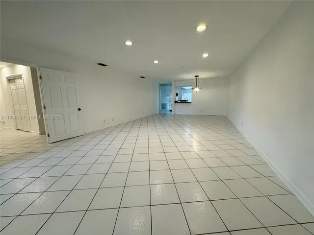 an empty room with a bathroom