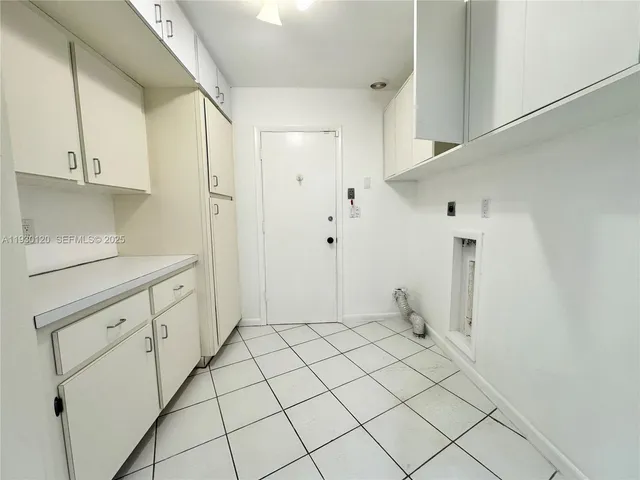 a open kitchen with stainless steel appliances kitchen island granite countertop a refrigerator and a sink