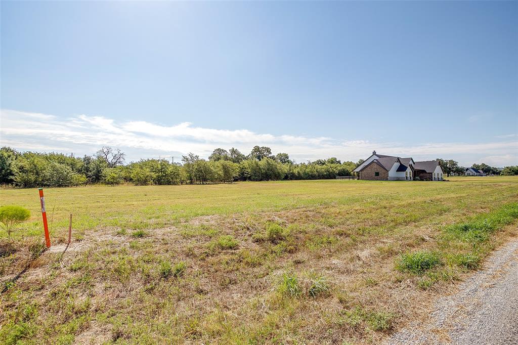 2012 Carrie Court Weatherford, TX 76088 - Photo 7 of 10 a view of a lake with houses in the back