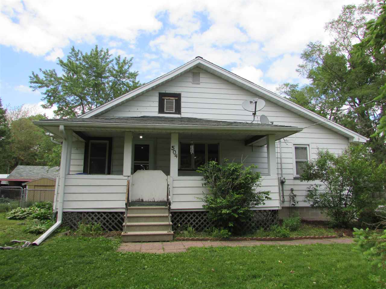 504 Barry Road Rockford, IL 61109 - Photo 1 of 31 a front view of a house with a yard