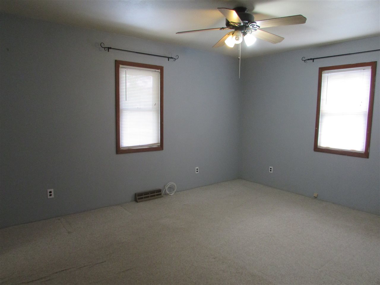 504 Barry Road Rockford, IL 61109 - Photo 14 of 31 an empty room with a window and a fan