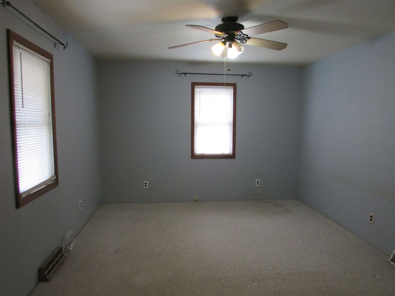 504 Barry Road Rockford, IL 61109 - Photo 15 of 31 an empty room with a window and a fan