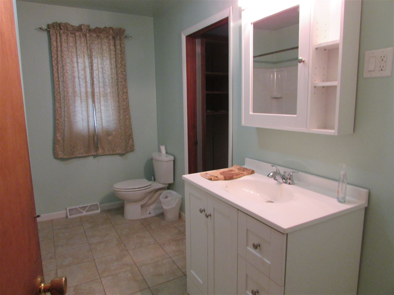 504 Barry Road Rockford, IL 61109 - Photo 16 of 31 a bathroom with a sink and a toilet