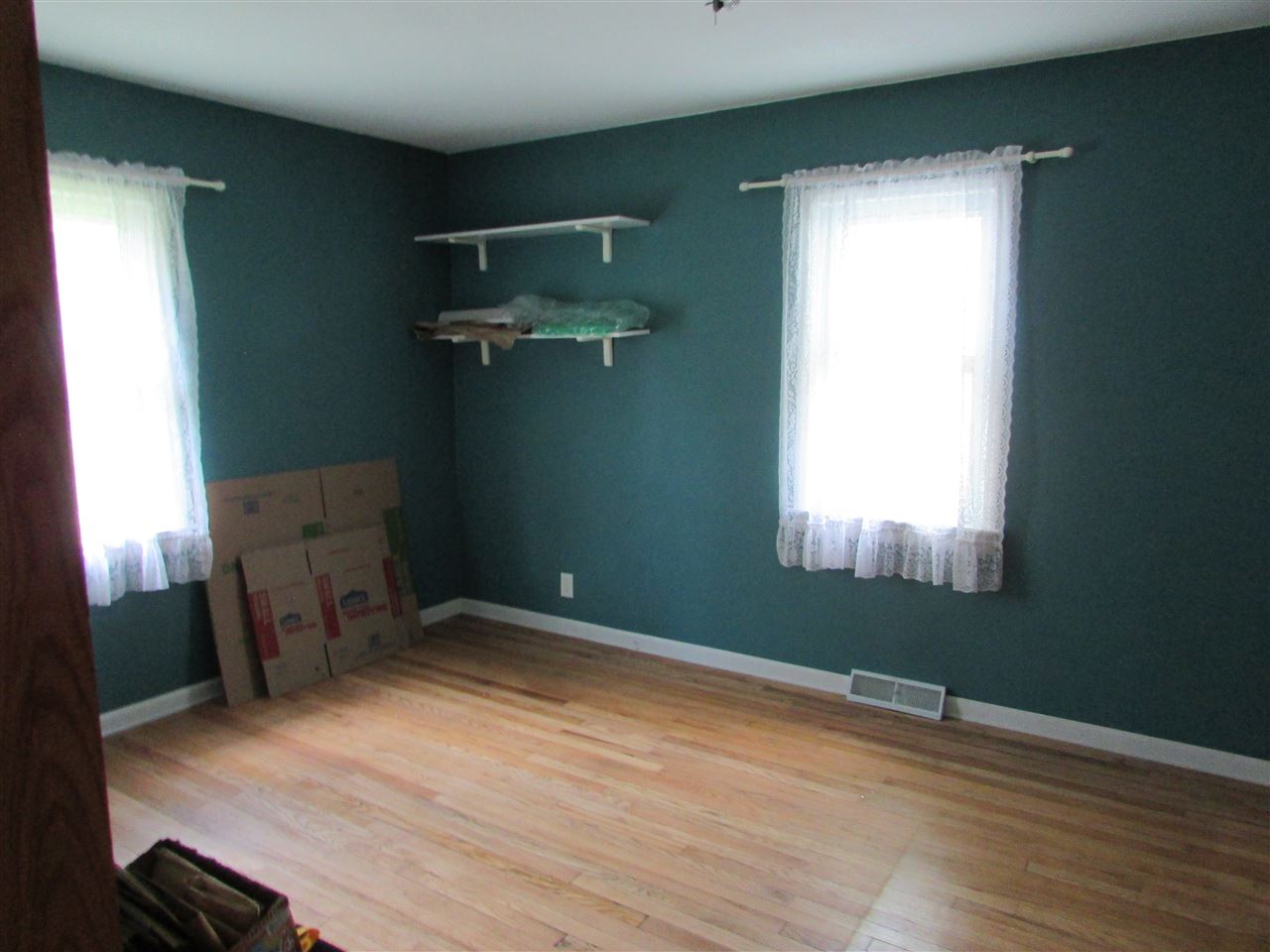 504 Barry Road Rockford, IL 61109 - Photo 20 of 31 a view of empty room with wooden floor and fan