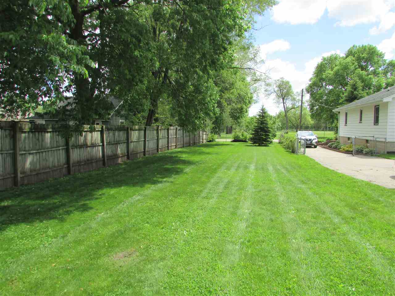 504 Barry Road Rockford, IL 61109 - Photo 24 of 31 a view of a yard with a house and a large tree
