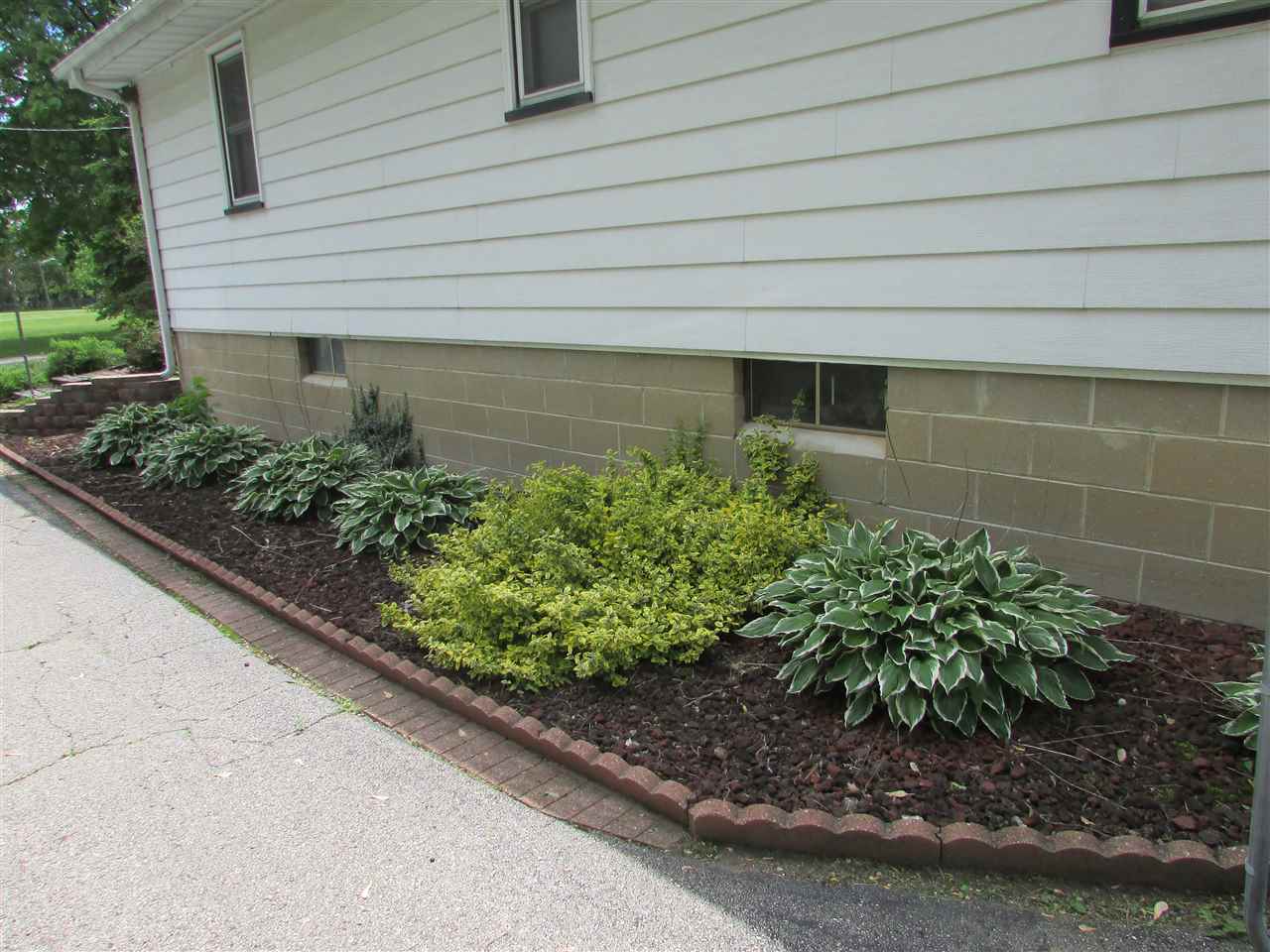 504 Barry Road Rockford, IL 61109 - Photo 29 of 31 a front view of a house with garden