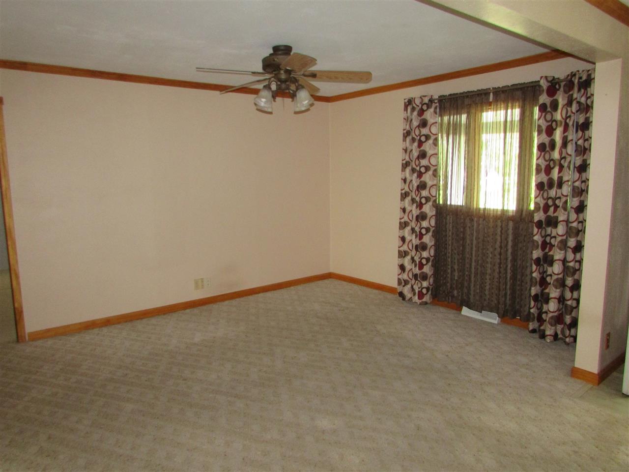 504 Barry Road Rockford, IL 61109 - Photo 4 of 31 a view of an empty room with a window