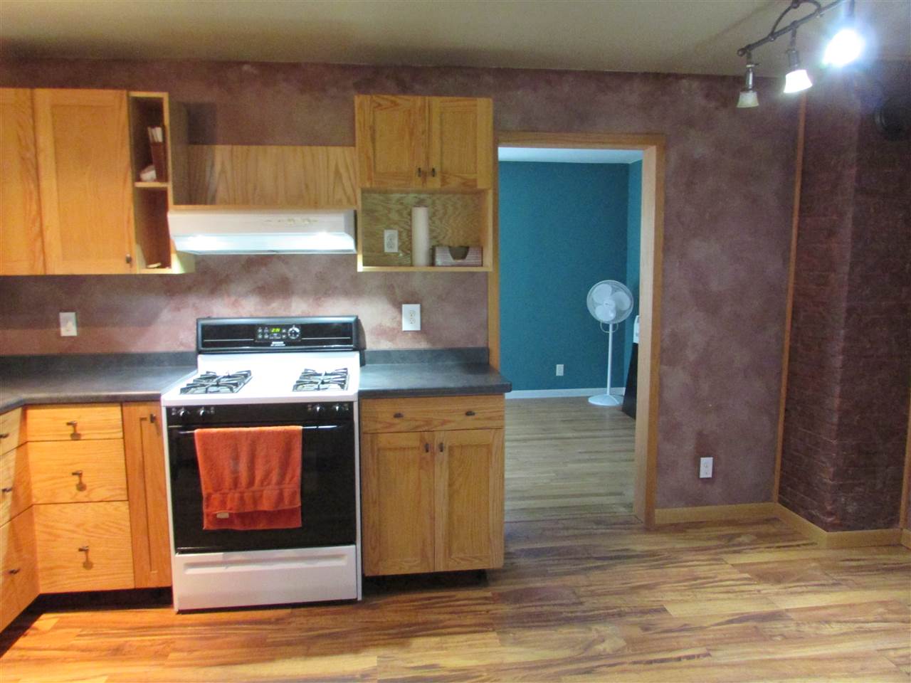 504 Barry Road Rockford, IL 61109 - Photo 9 of 31 a kitchen with stainless steel appliances granite countertop a stove a sink and a microwave oven with cabinets