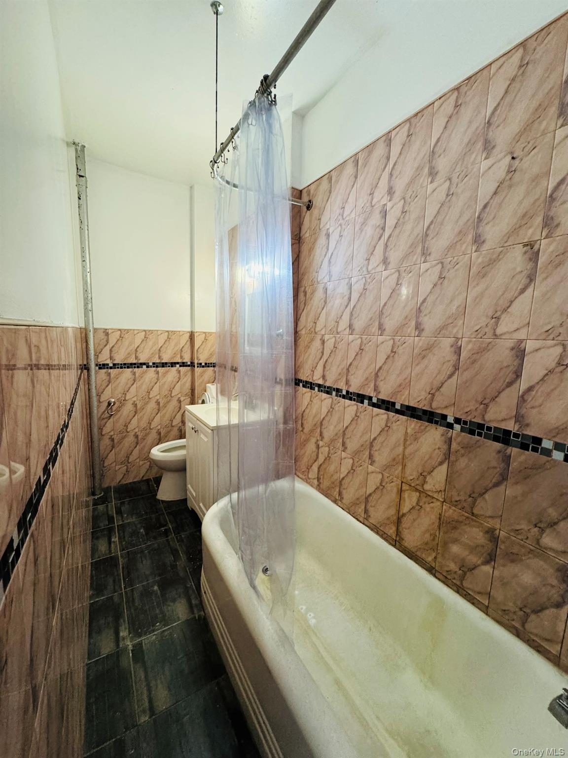 25-38 22nd Street, Unit 1 Queens, NY 11102 - Photo 14 of 19 a bathroom with a bathtub and shower