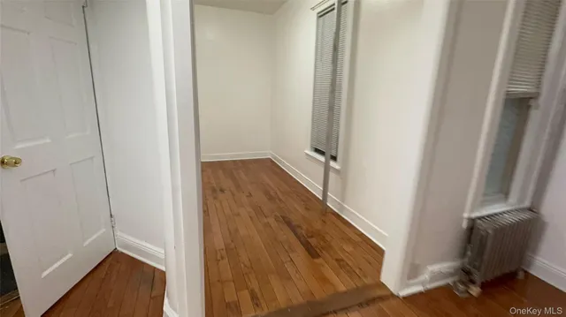 a view of room with wooden floor