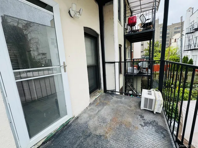 a view of a balcony with chairs
