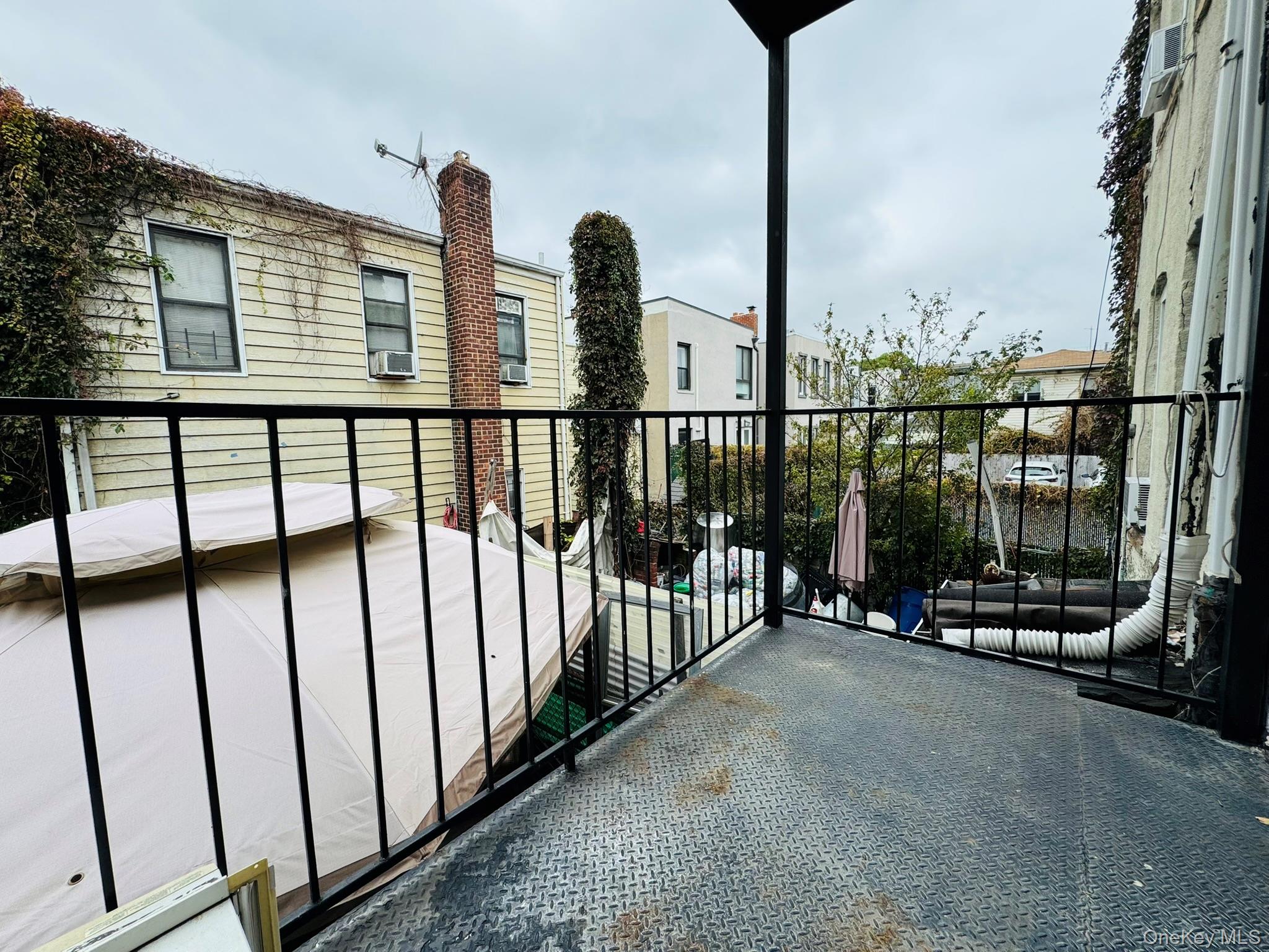 25-38 22nd Street, Unit 1 Queens, NY 11102 - Photo 4 of 19 a view of a balcony with chairs