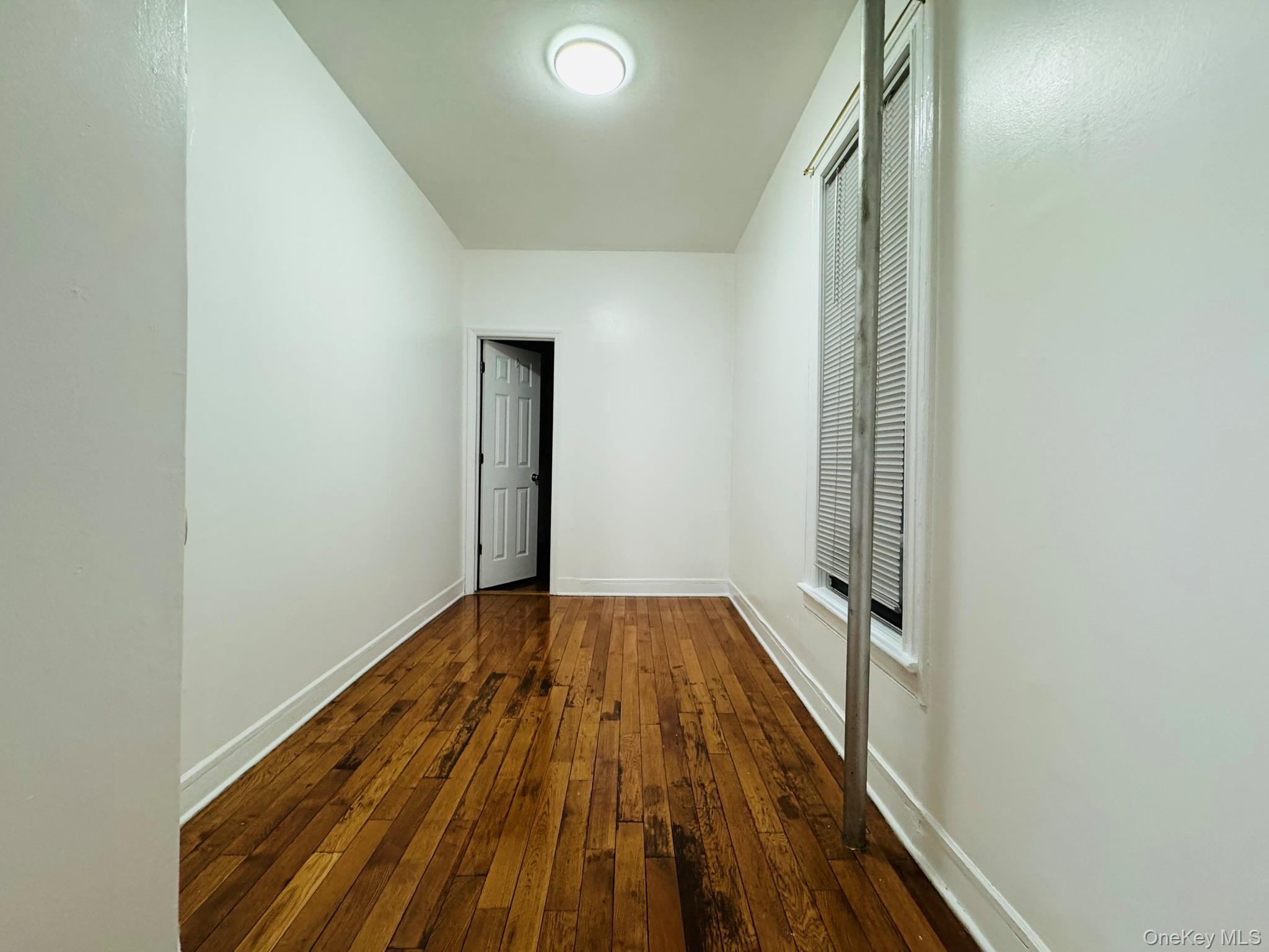 25-38 22nd Street, Unit 1 Queens, NY 11102 - Photo 7 of 19 a view of a hallway with wooden floor