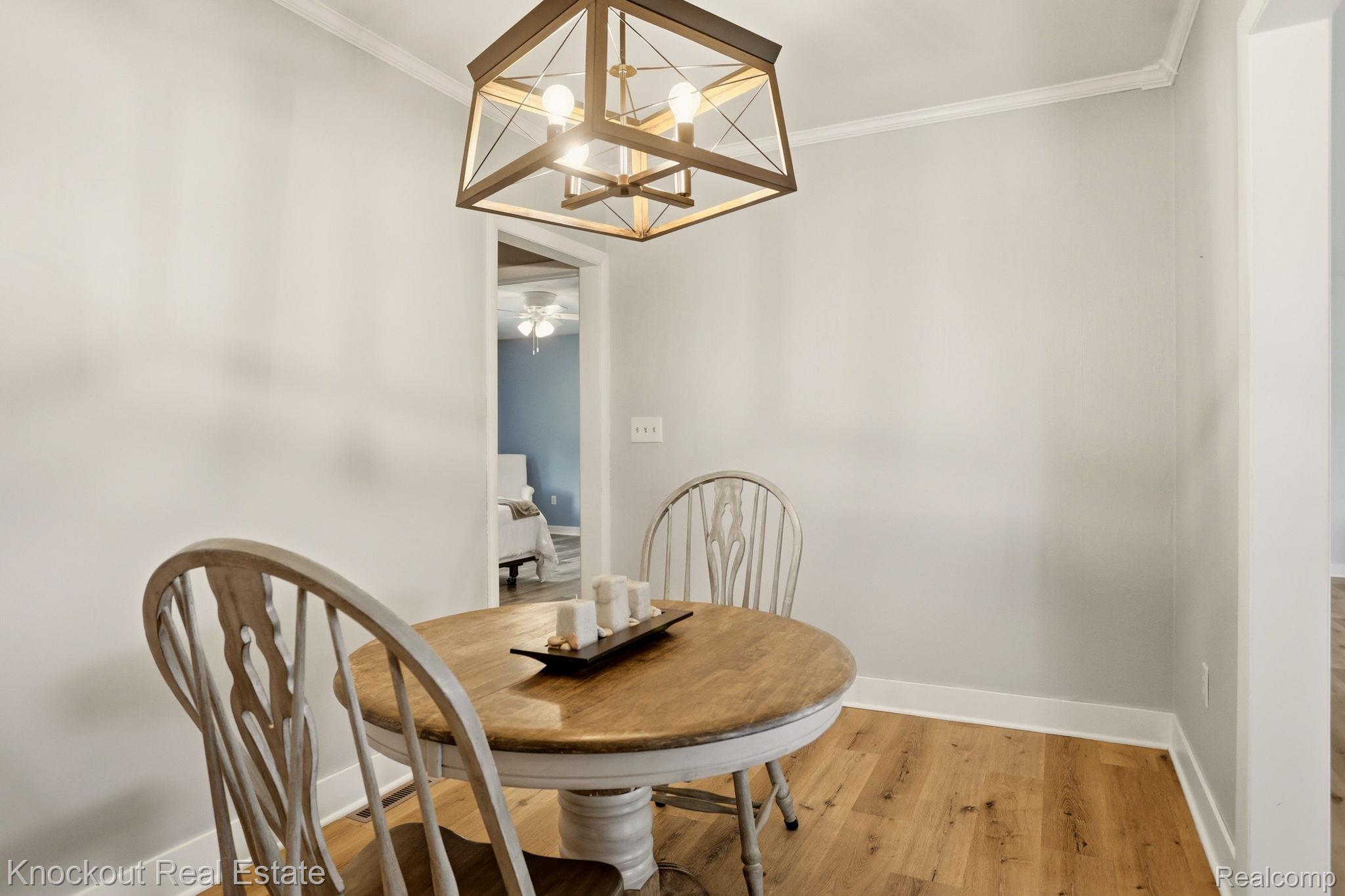9941 Lange Road Birch Run, MI 48415 - Photo 23 of 42 Open concept dining area featuring wood-finish flooring