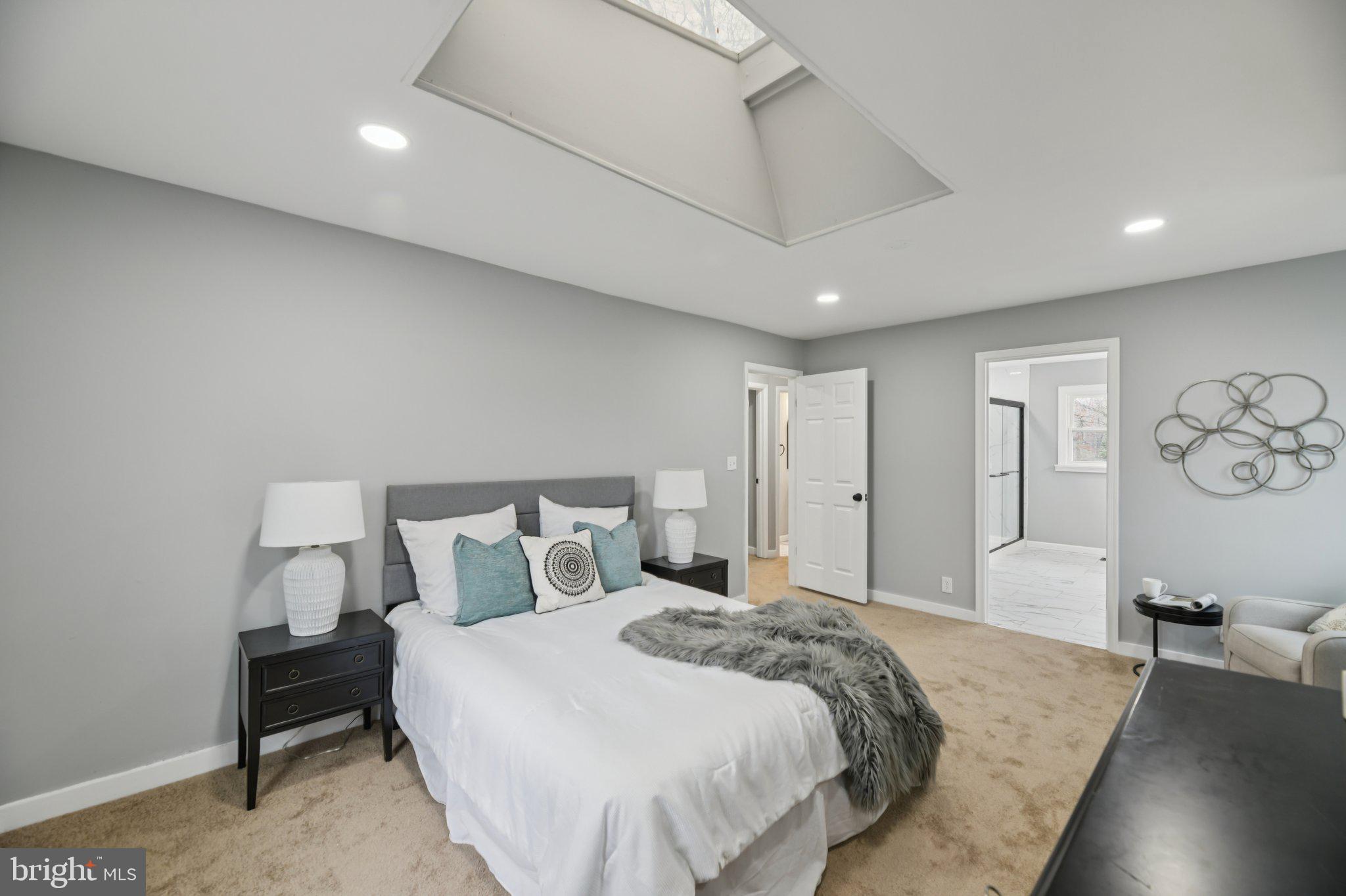 14610 Brandywine Heights Road Brandywine, MD 20613 - Photo 12 of 25 a spacious bedroom with a bed and a couch