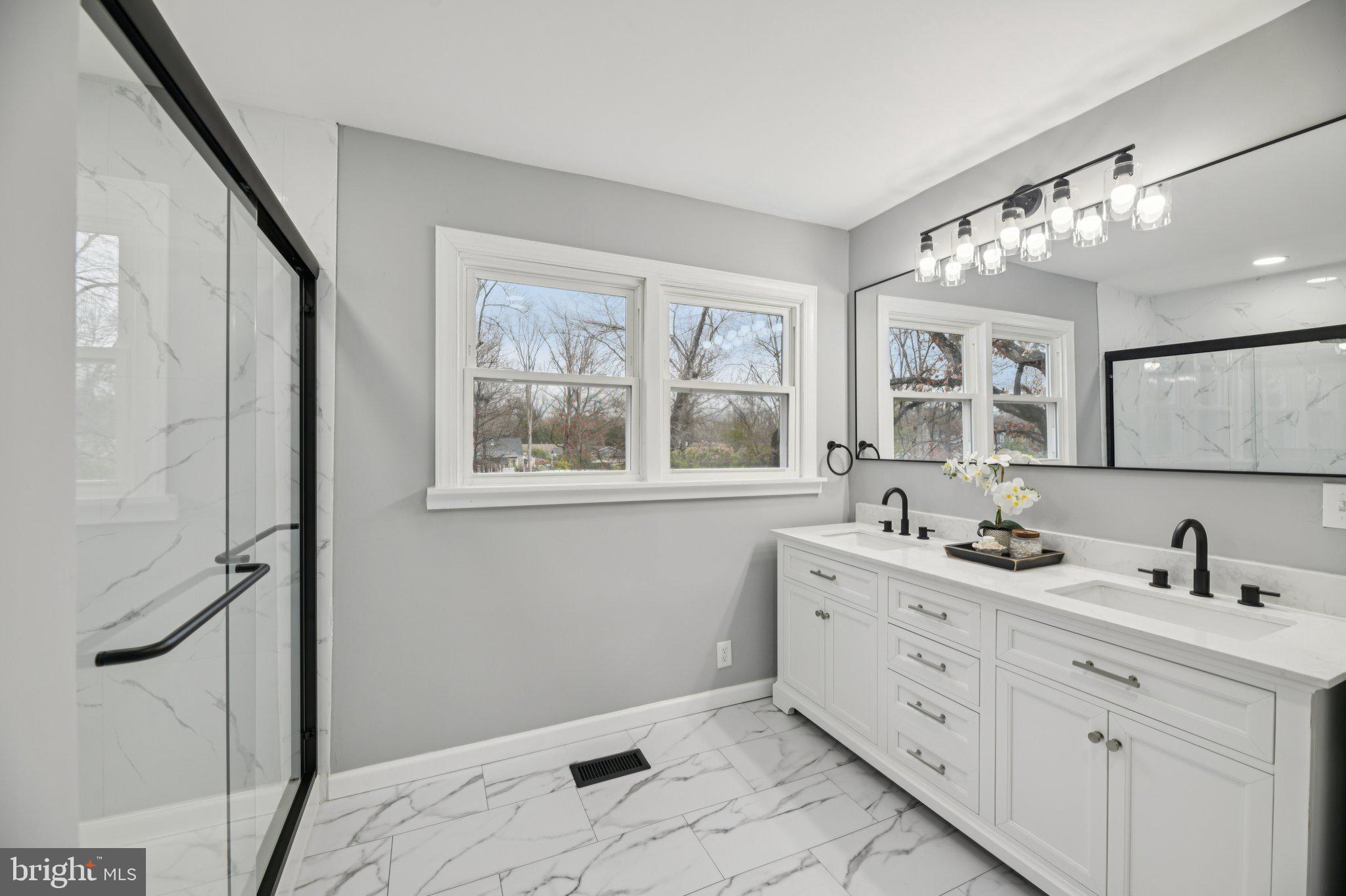 14610 Brandywine Heights Road Brandywine, MD 20613 - Photo 13 of 25 a bathroom with a double vanity sink mirror and window