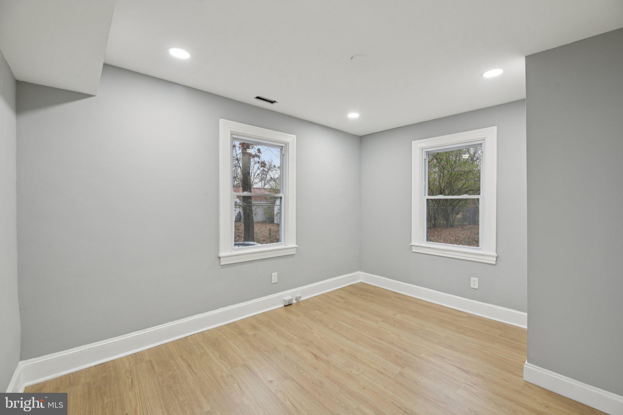 14610 Brandywine Heights Road Brandywine, MD 20613 - Photo 14 of 25 an empty room with wooden floor and windows