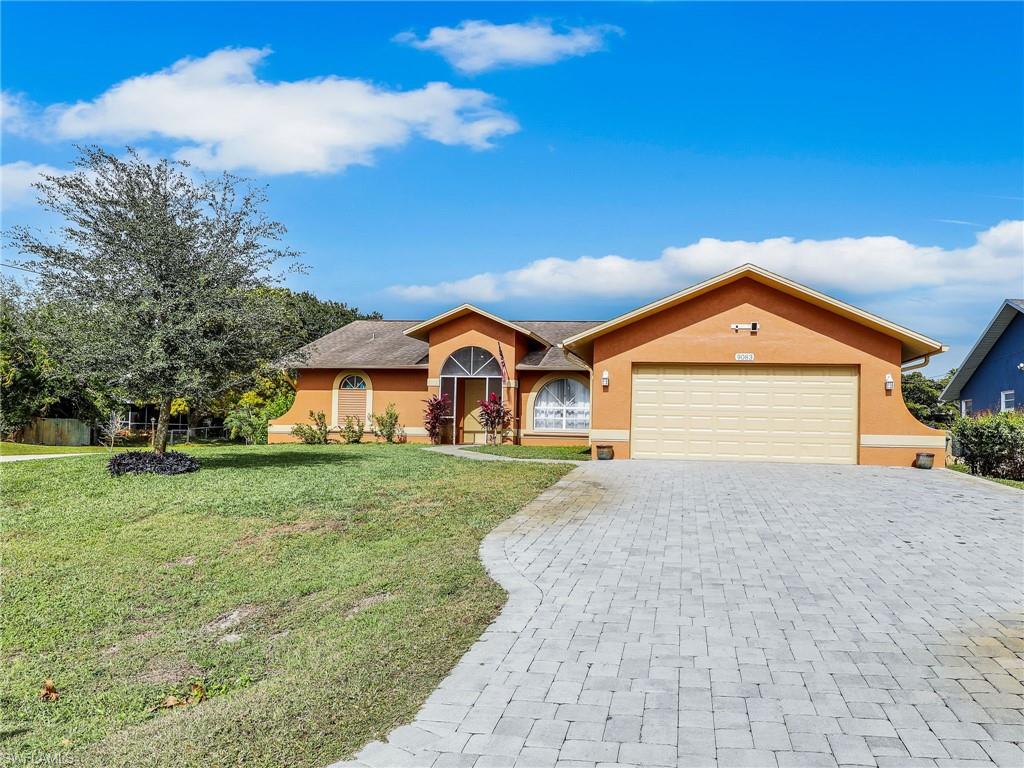 9083 Aster Road Fort Myers, FL 33967 - Photo 1 of 30 a view of a house with a yard