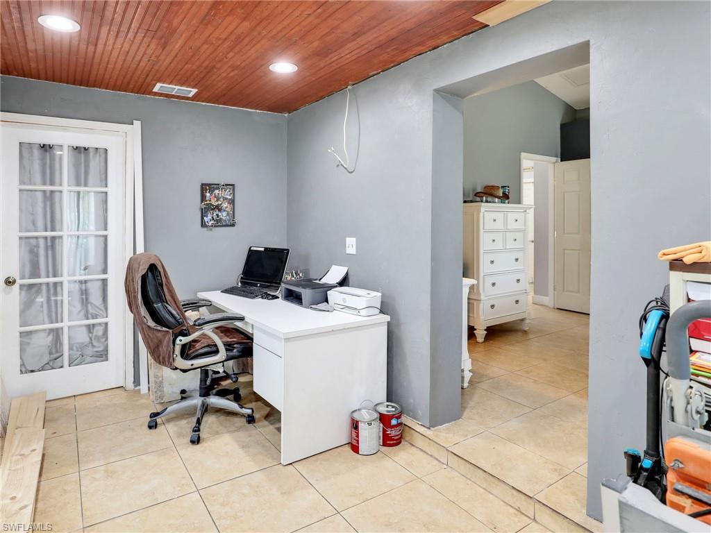9083 Aster Road Fort Myers, FL 33967 - Photo 18 of 30 a view of a workspace with furniture