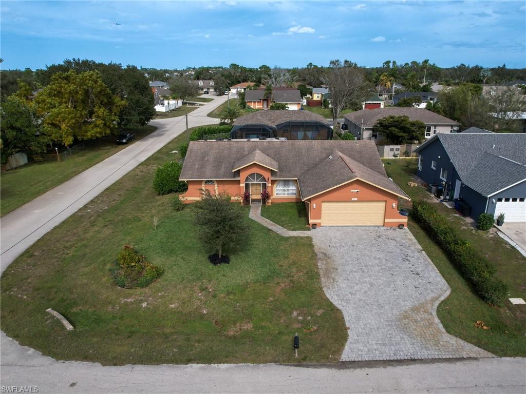 9083 Aster Road Fort Myers, FL 33967 - Photo 28 of 30 an aerial view of a house with a yard