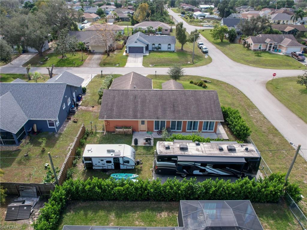9083 Aster Road Fort Myers, FL 33967 - Photo 29 of 30 an aerial view of a house with garden space and swimming pool