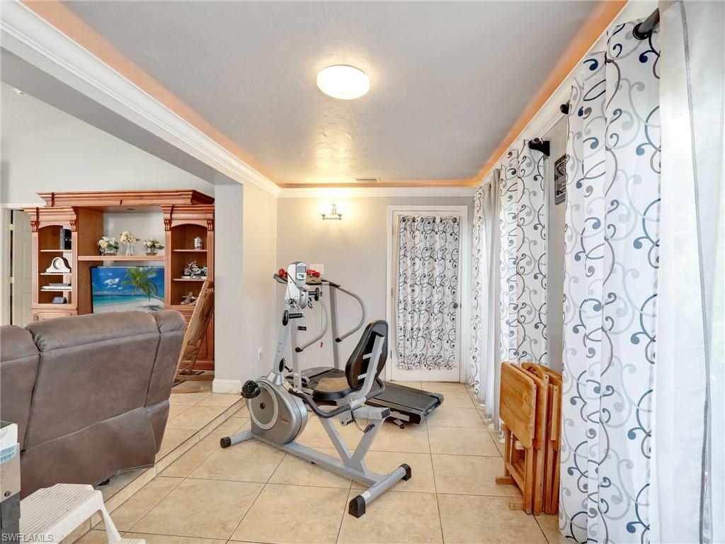 9083 Aster Road Fort Myers, FL 33967 - Photo 9 of 30 a view of a room with gym equipment