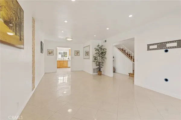 a large kitchen with stainless steel appliances granite countertop a sink and a stove
