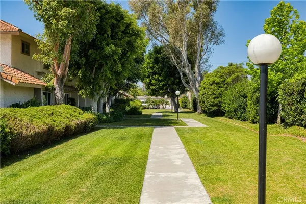 a swimming pool with outdoor seating and yard