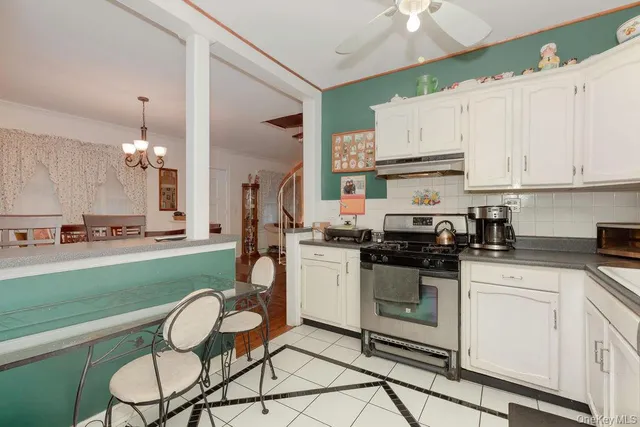 a kitchen with a sink cabinets and stainless steel appliances