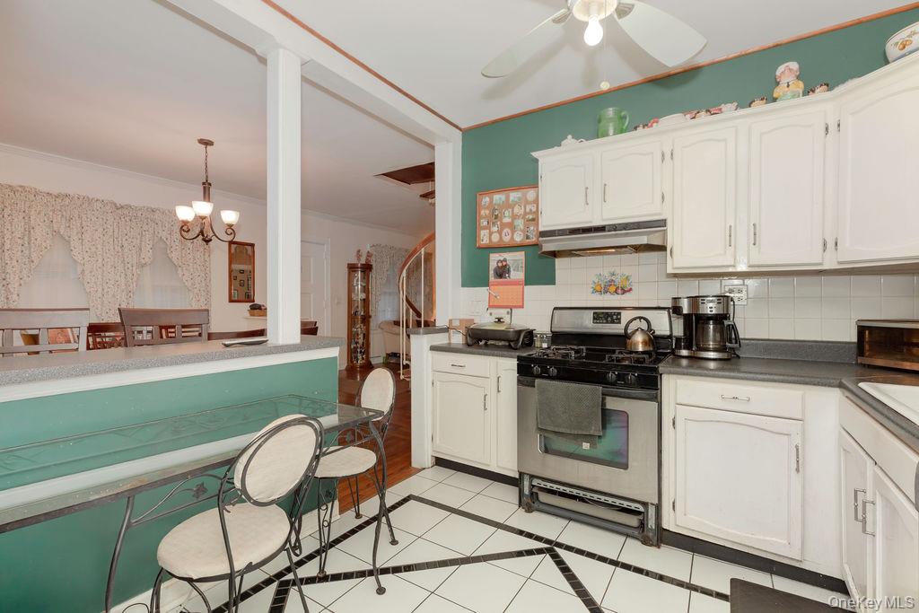 104 Fordham Street, Unit 5 Bronx, NY 10464 - Photo 12 of 27 a kitchen with a sink cabinets and stainless steel appliances