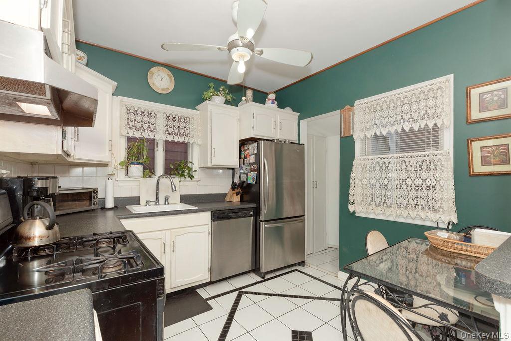 104 Fordham Street, Unit 5 Bronx, NY 10464 - Photo 14 of 27 a kitchen with stainless steel appliances granite countertop a stove a refrigerator and a sink