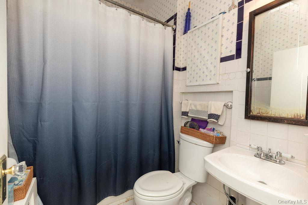 104 Fordham Street, Unit 5 Bronx, NY 10464 - Photo 16 of 27 a bathroom with a sink toilet and shower