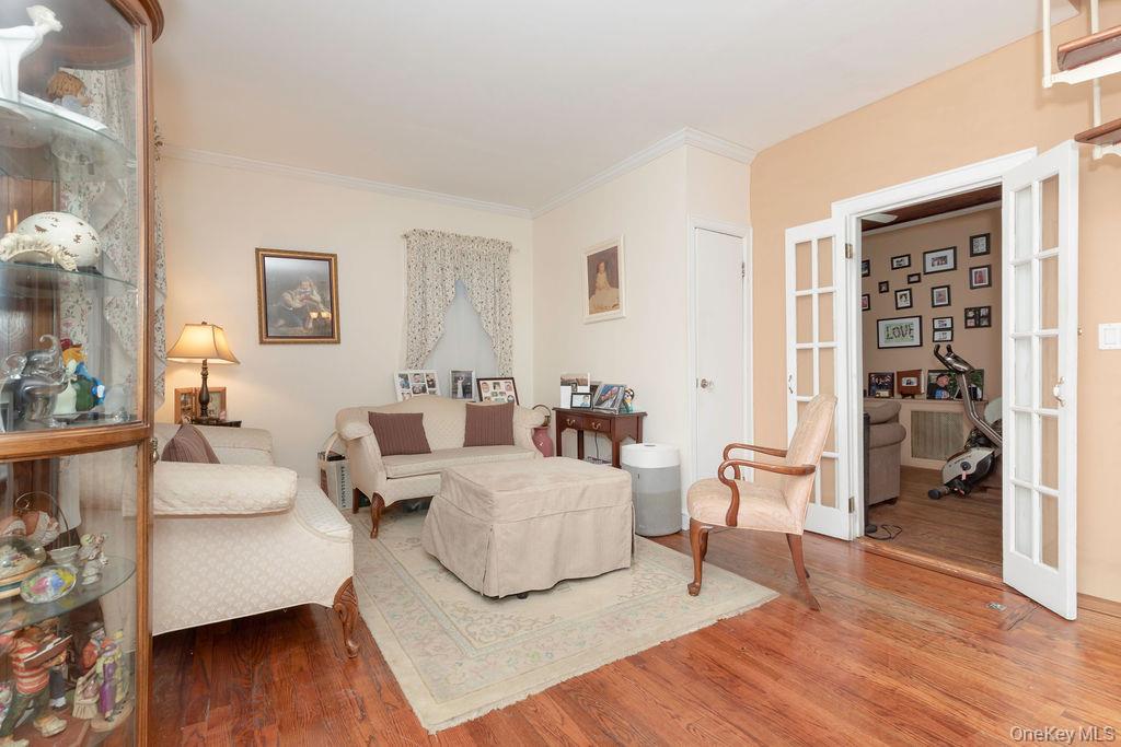 104 Fordham Street, Unit 5 Bronx, NY 10464 - Photo 5 of 27 a living room with furniture and a wooden floor