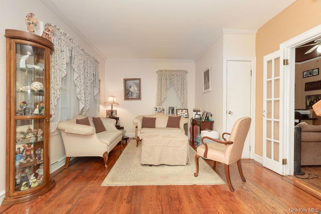 104 Fordham Street, Unit 5 Bronx, NY 10464 - Photo 7 of 27 a living room with furniture and a wooden floor