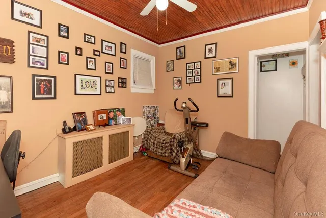 a living room with furniture a chandelier and a window
