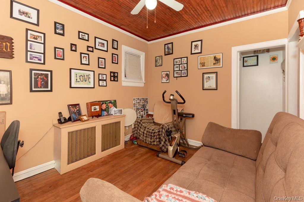 104 Fordham Street, Unit 5 Bronx, NY 10464 - Photo 10 of 27 a living room with furniture a chandelier and a window