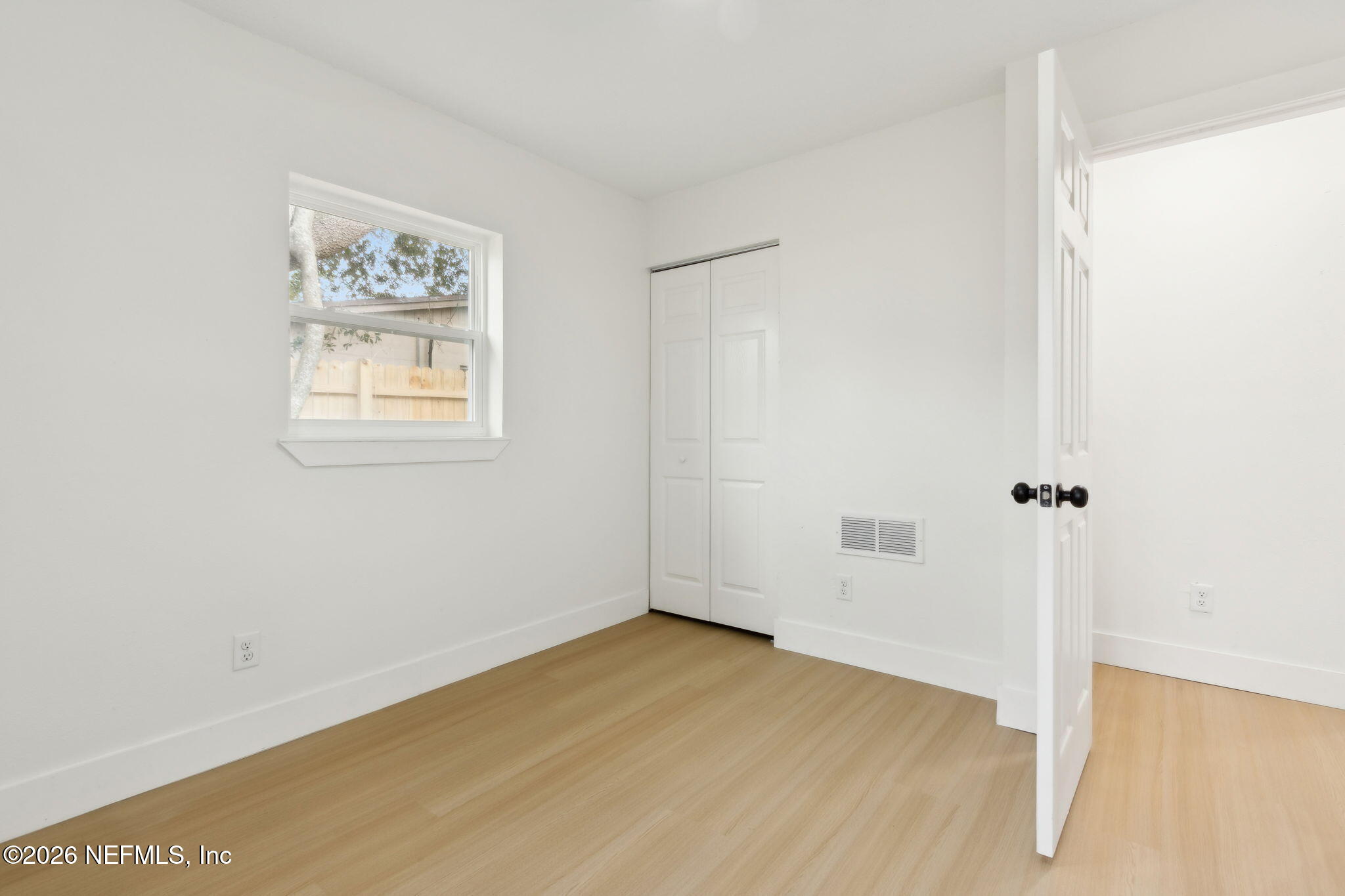 14051 Claridge Road North Jacksonville, FL 32250 - Photo 28 of 43 a view of a room with wooden floor and a window