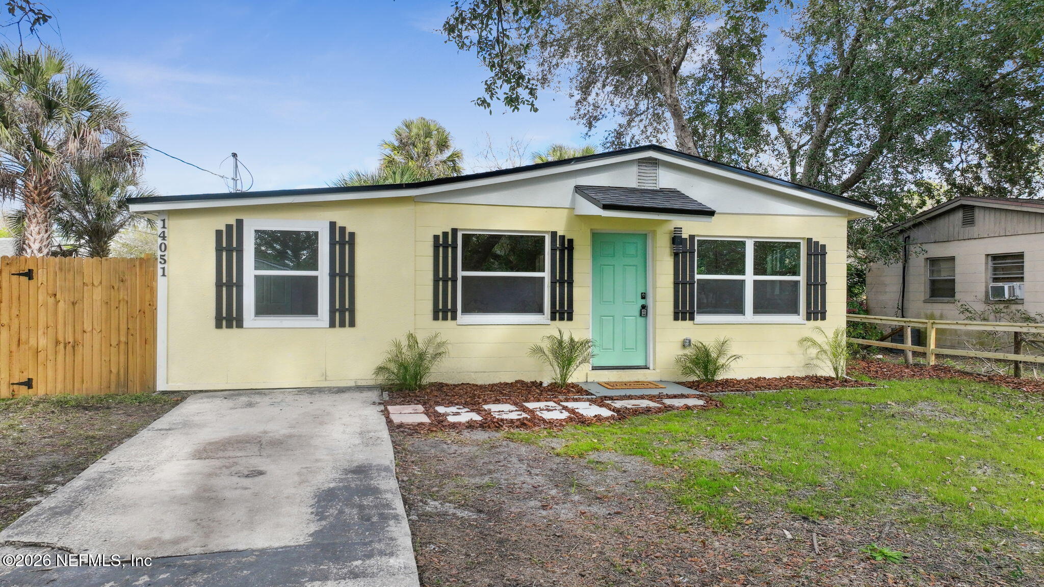 14051 Claridge Road North Jacksonville, FL 32250 - Photo 38 of 43 a front view of a house with a yard