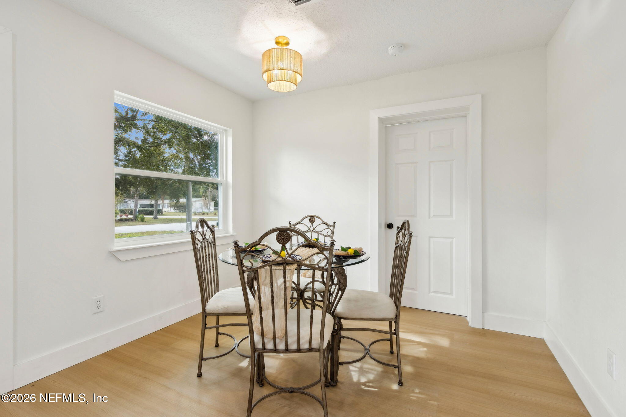 14051 Claridge Road North Jacksonville, FL 32250 - Photo 8 of 43 a view of a dining room with furniture and a window