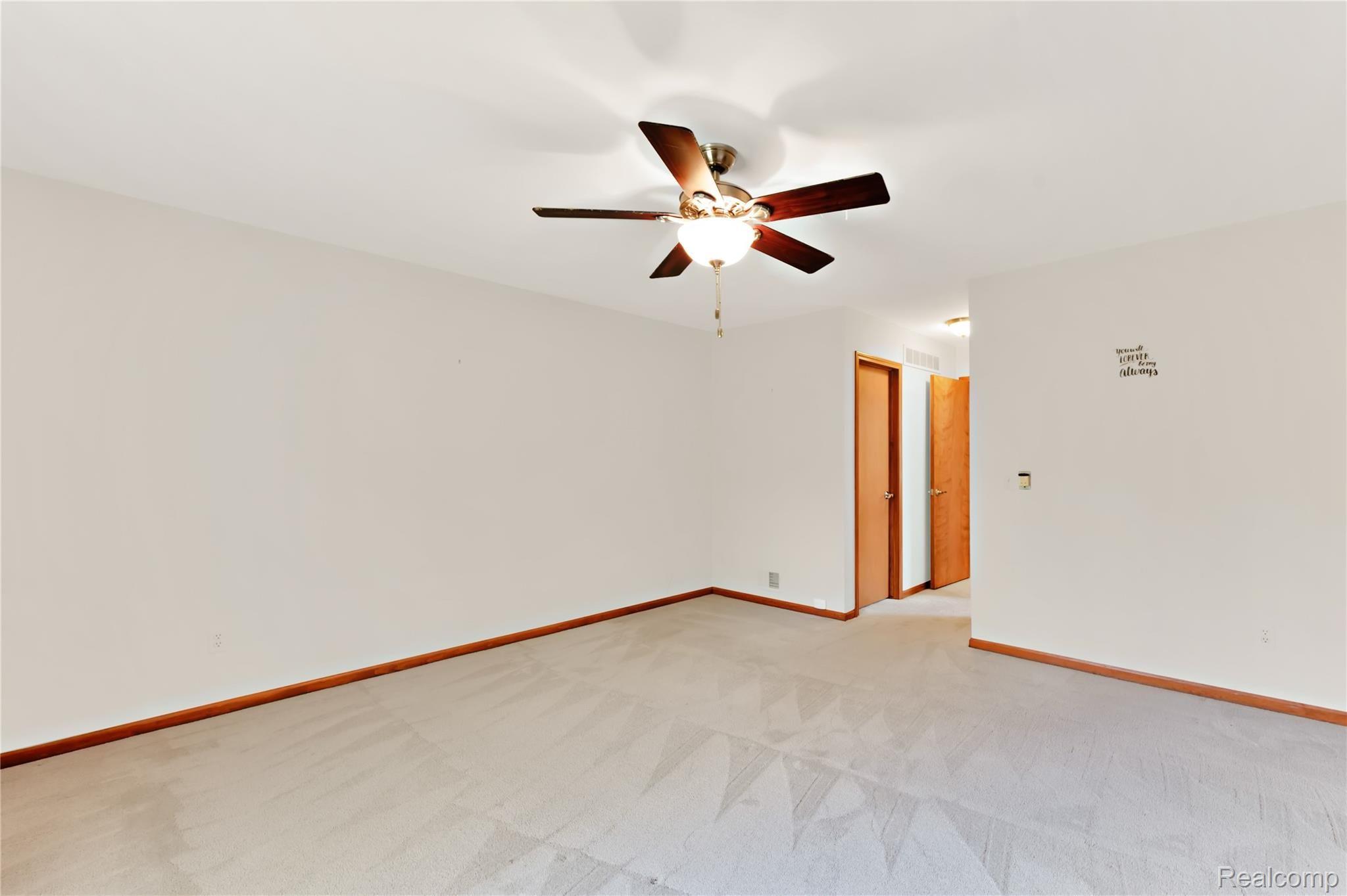 1239 Bembridge Drive Rochester, MI 48307 - Photo 16 of 33 master bedroom leading to closet and ensuite bathroom