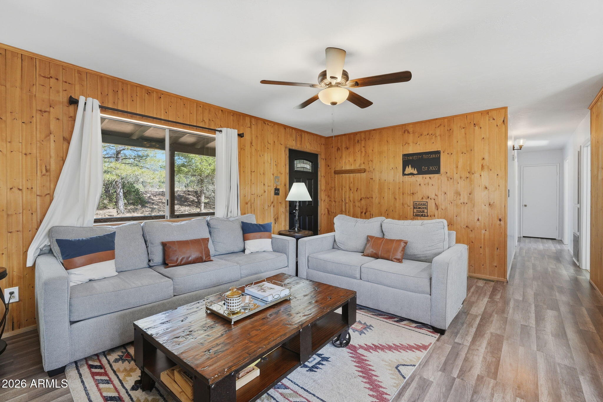 8247 Ralls Drive Pine, AZ 85544 - Photo 10 of 50 a living room with furniture and a large window