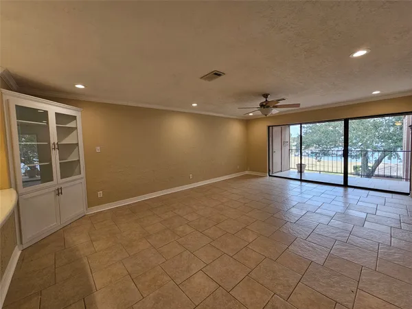 a view of a kitchen with a sink and cabinets
