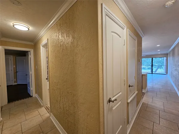 a view of a room with a dishwasher and a fireplace
