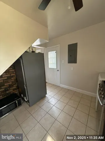 a view of an empty room and wooden floor