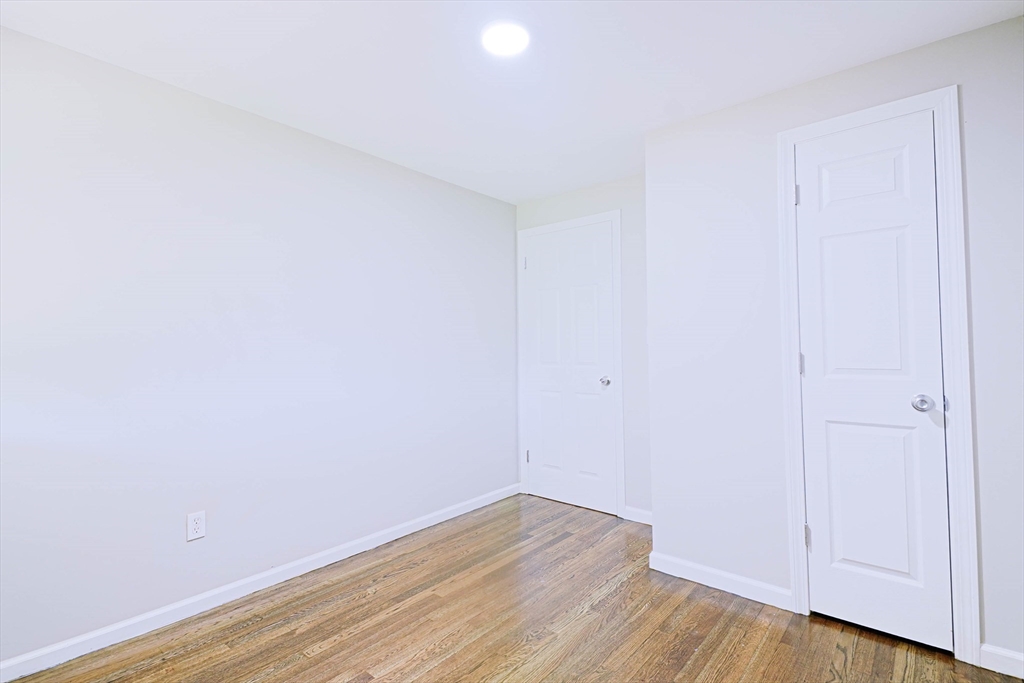 102 McCarthy Avenue Chicopee, MA 01020 - Photo 11 of 18 a view of an empty room with wooden floor