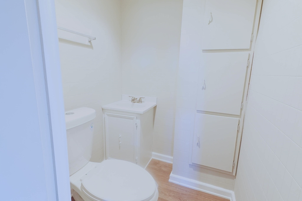102 McCarthy Avenue Chicopee, MA 01020 - Photo 17 of 18 a white toilet sitting next to a shower