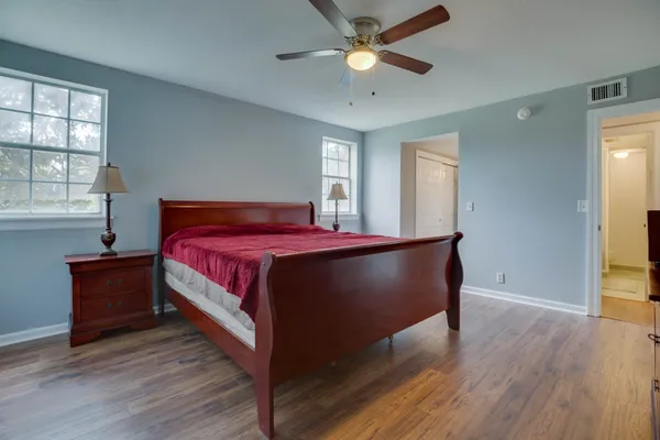 a bedroom with a bed and window